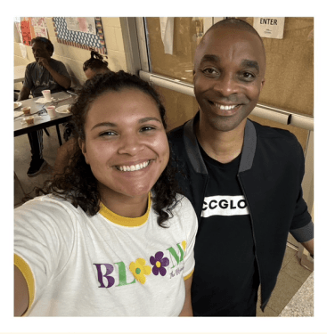Mentor and community partner smiling together at a program event